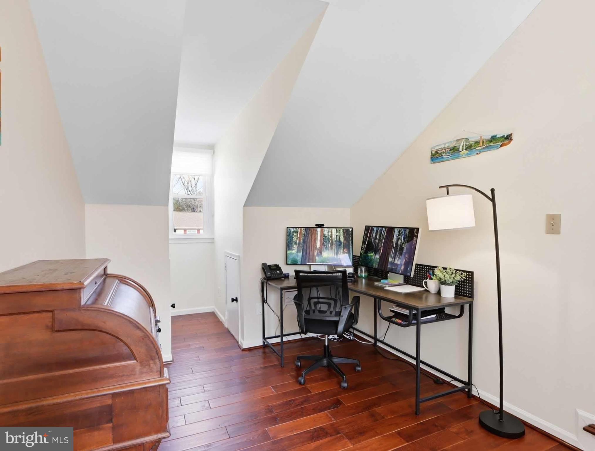 12208 Stoney Bottom Road Germantown, MD 20874 - Photo 24 of 52 a room with furniture and a wooden floor