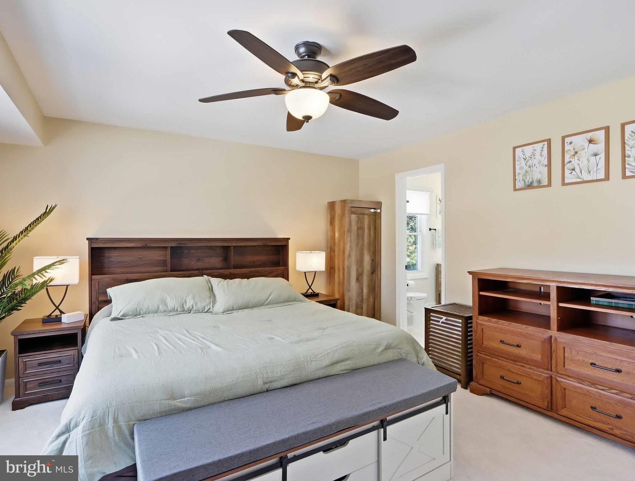 12208 Stoney Bottom Road Germantown, MD 20874 - Photo 26 of 52 a bedroom with a bed and a ceiling fan