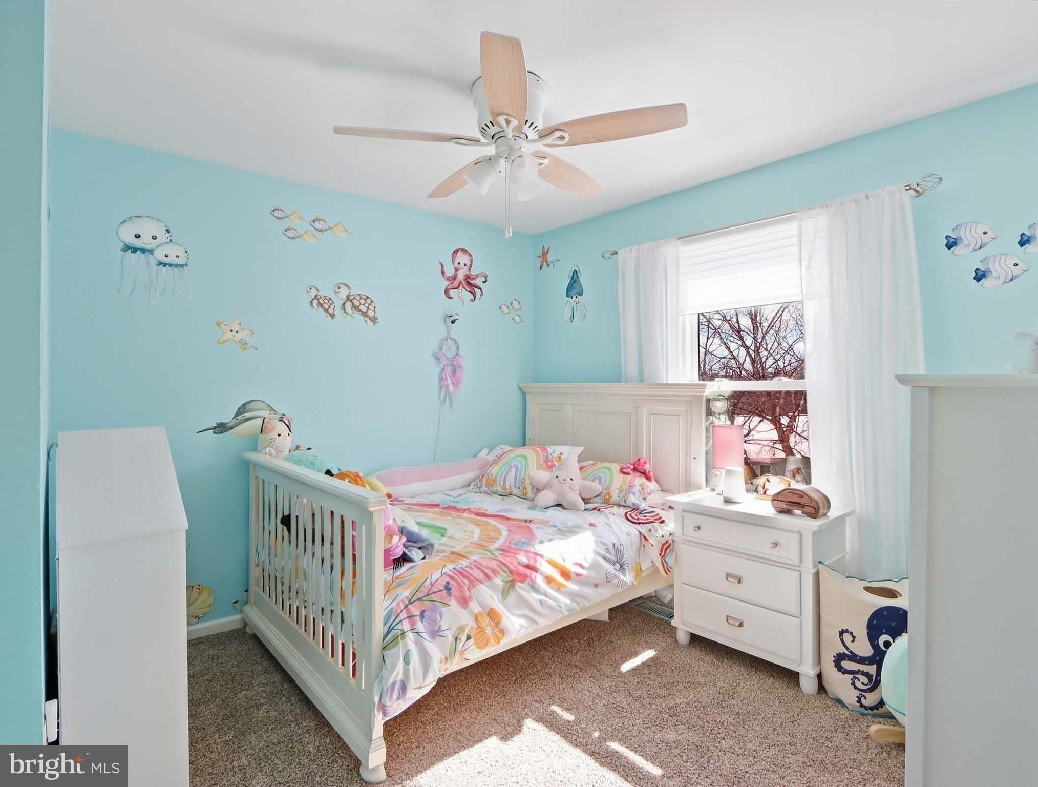 12208 Stoney Bottom Road Germantown, MD 20874 - Photo 30 of 52 a bedroom with a bed and a baby bed