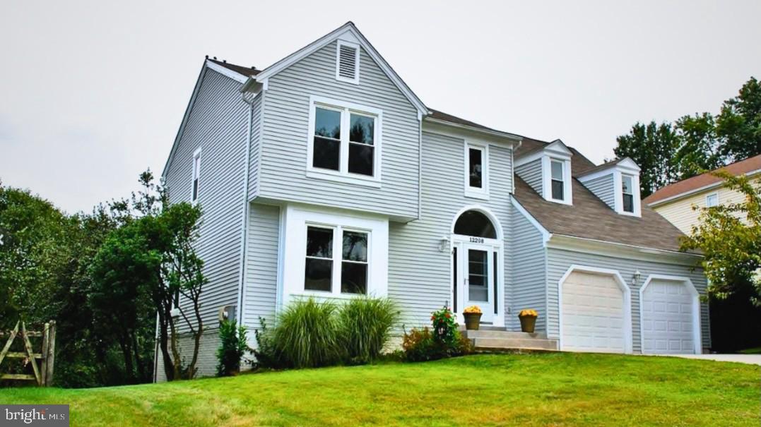 12208 Stoney Bottom Road Germantown, MD 20874 - Photo 3 of 52 a front view of a house with a yard