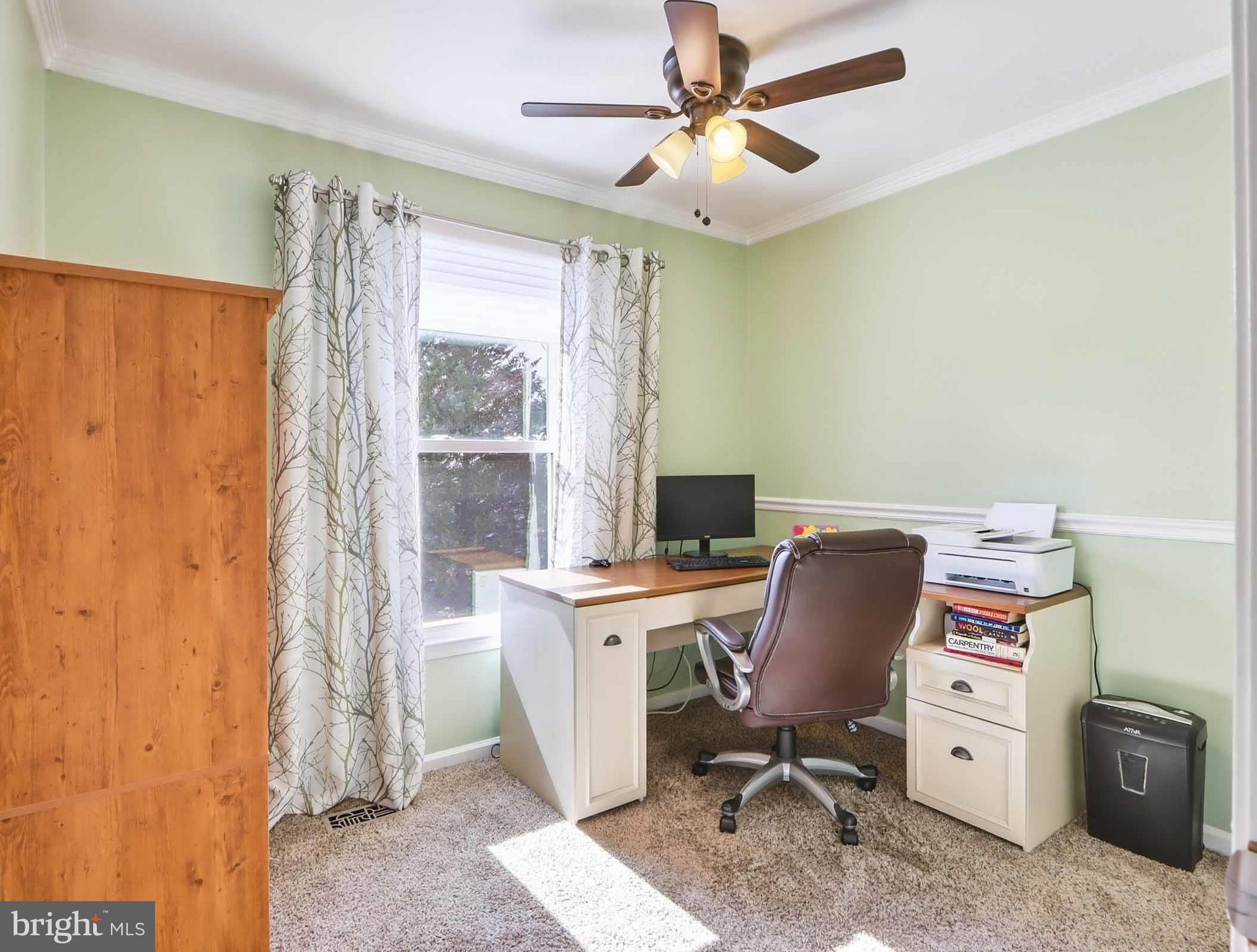 12208 Stoney Bottom Road Germantown, MD 20874 - Photo 32 of 52 a view of a workspace with furniture and a window