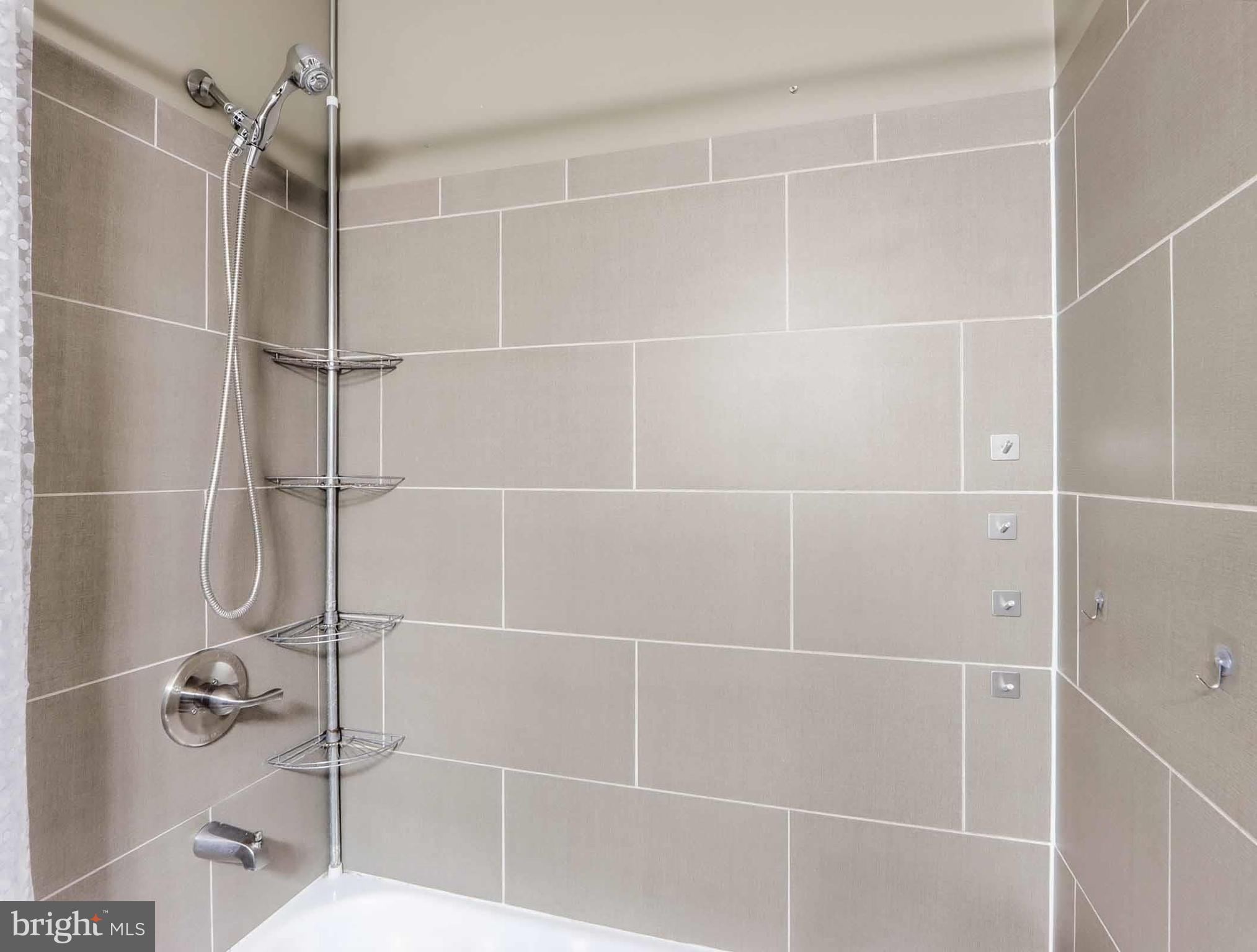 12208 Stoney Bottom Road Germantown, MD 20874 - Photo 34 of 52 a bathroom with a shower