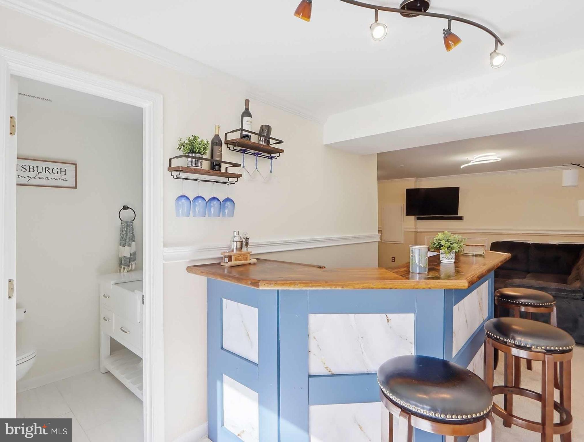 12208 Stoney Bottom Road Germantown, MD 20874 - Photo 38 of 52 a kitchen with stainless steel appliances a sink and a refrigerator