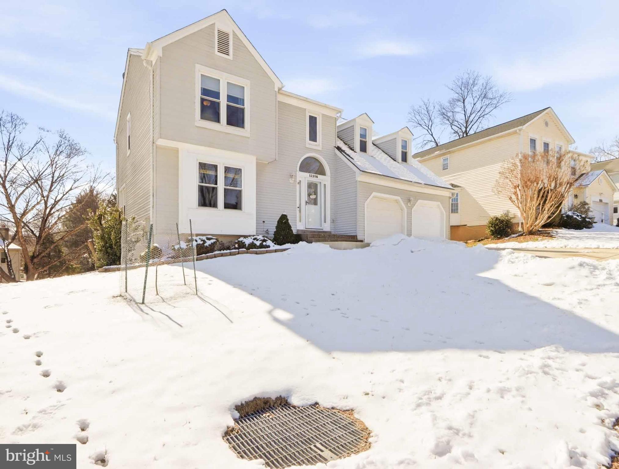 12208 Stoney Bottom Road Germantown, MD 20874 - Photo 4 of 52 a view of a house with snow on the road