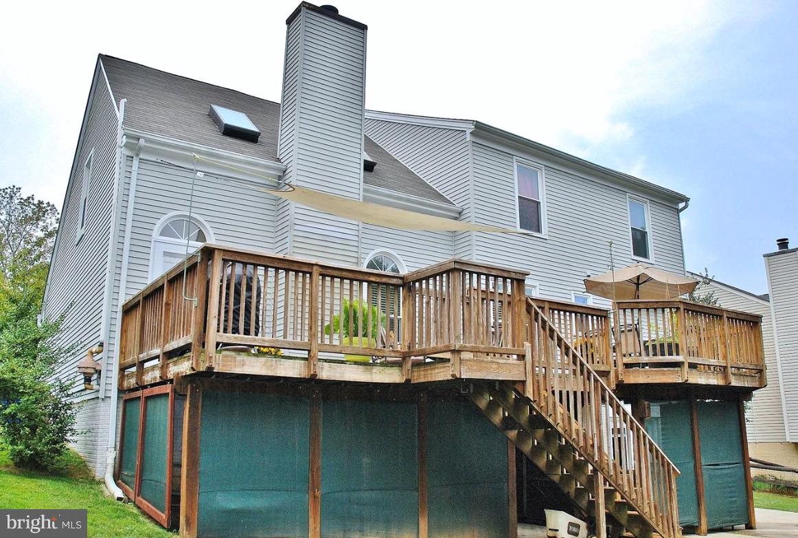 12208 Stoney Bottom Road Germantown, MD 20874 - Photo 44 of 52 a view of a house with a balcony