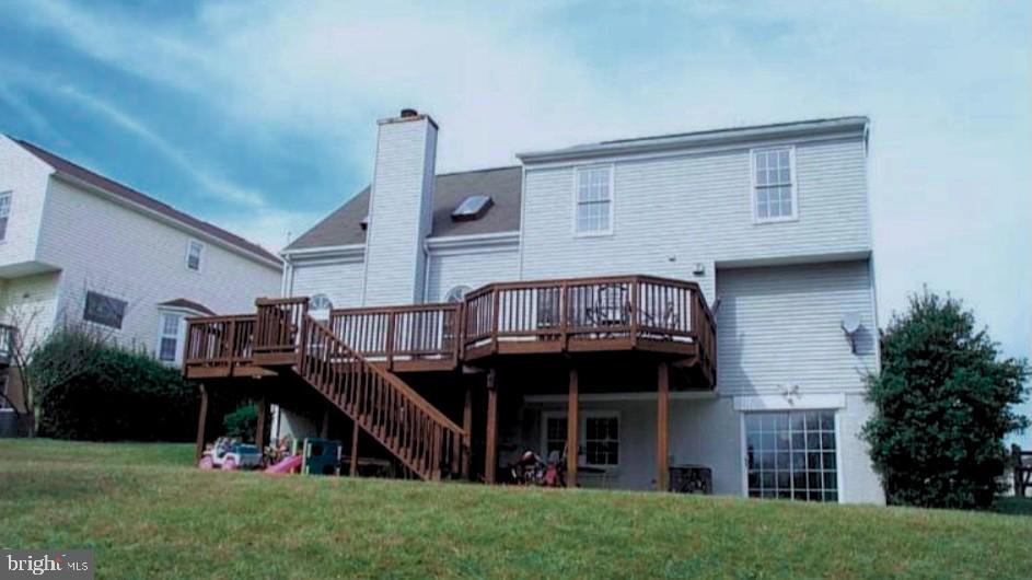 12208 Stoney Bottom Road Germantown, MD 20874 - Photo 45 of 52 a view of a house with a deck and a yard