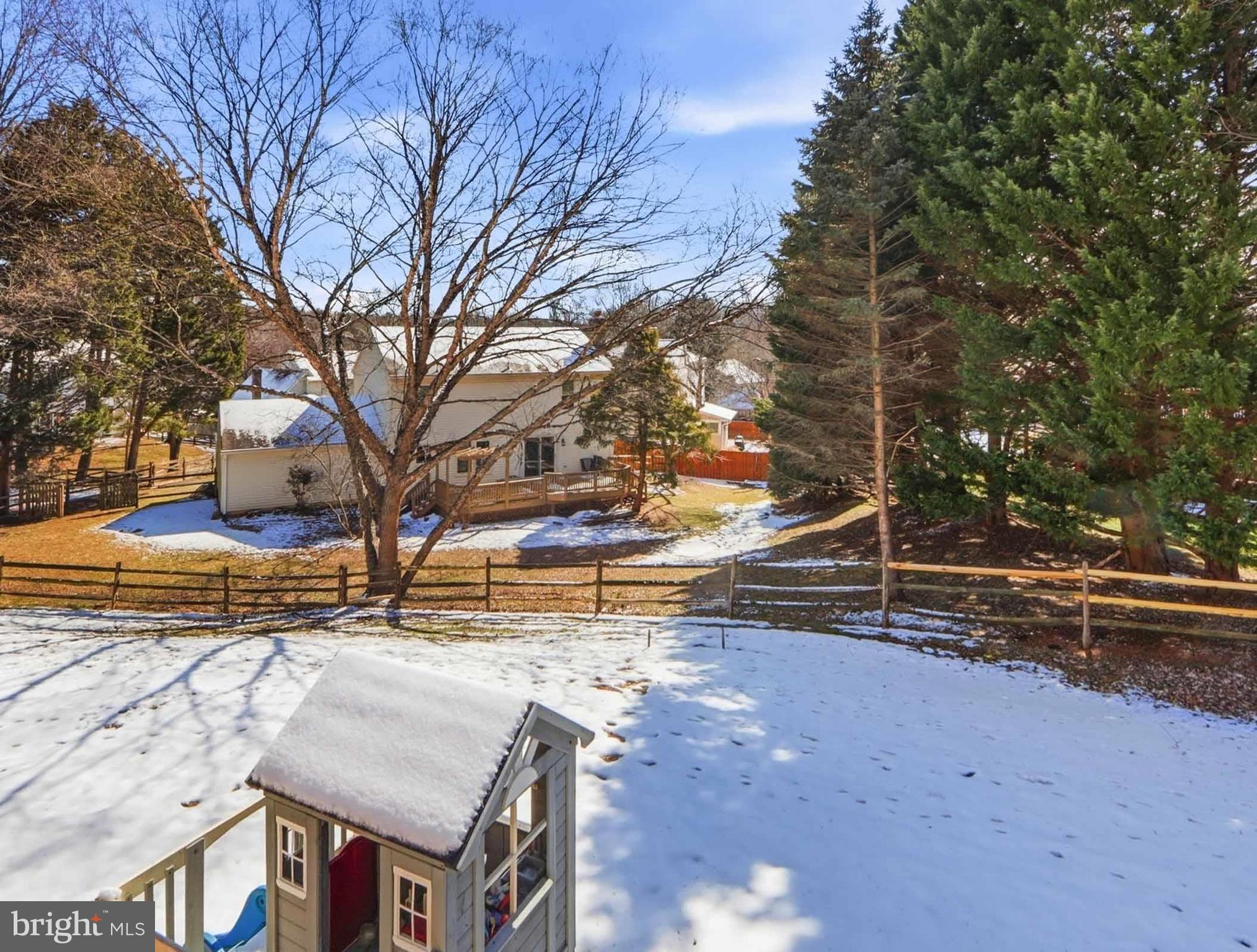 12208 Stoney Bottom Road Germantown, MD 20874 - Photo 51 of 52 a view of a yard with snow on the road