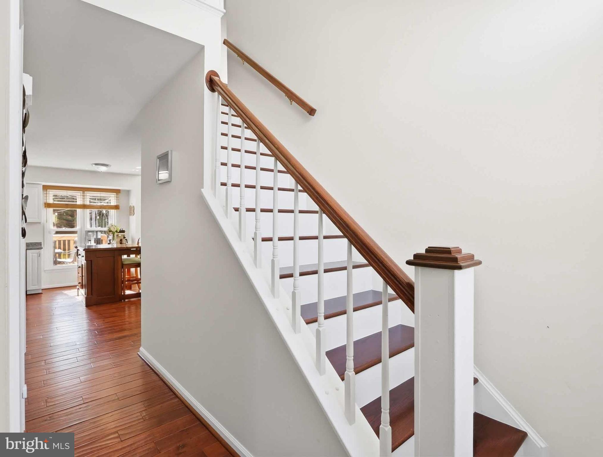 12208 Stoney Bottom Road Germantown, MD 20874 - Photo 8 of 52 a view of entryway and hall with wooden floor