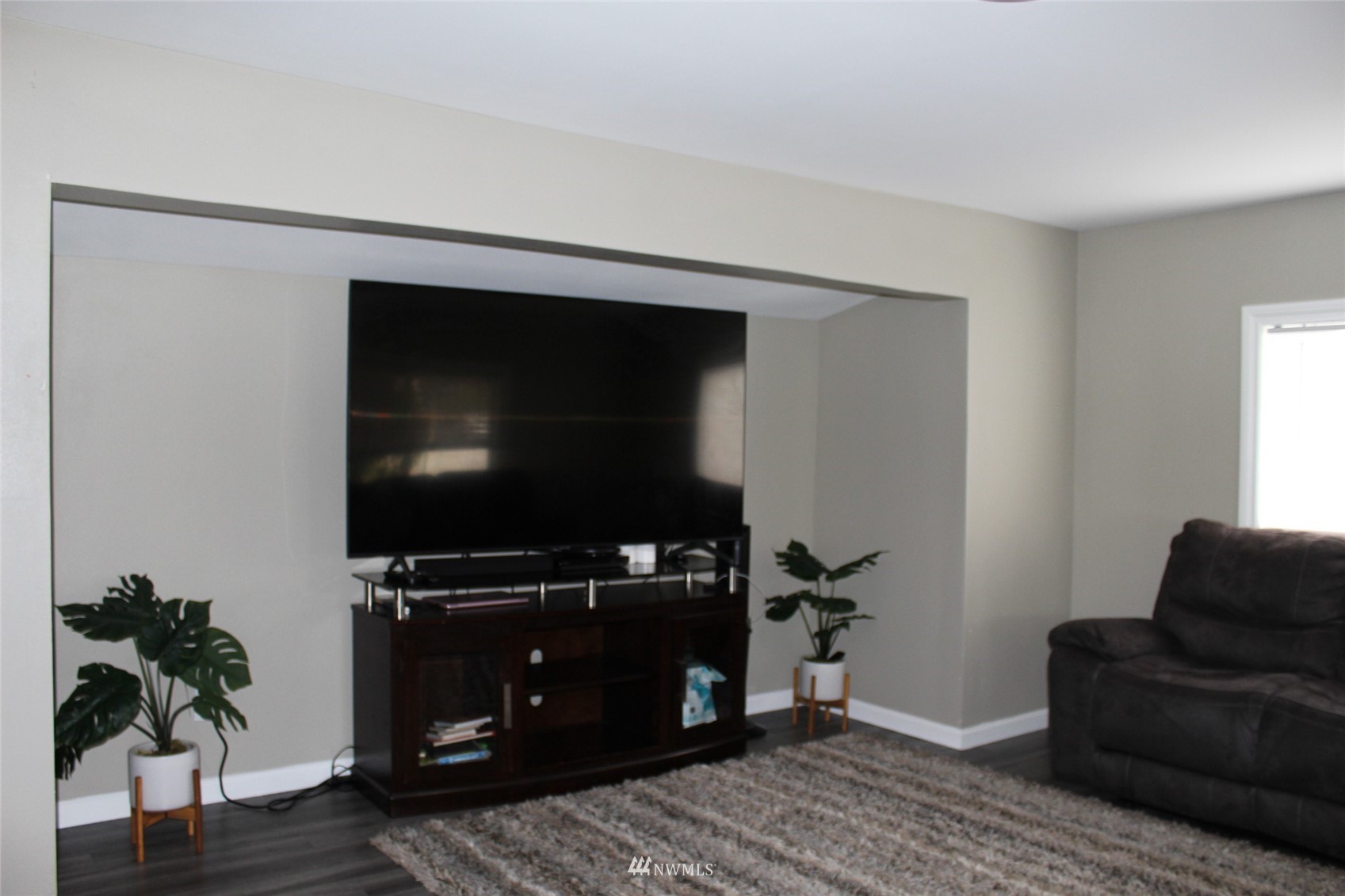 23708 Locust Way, Unit 3 Bothell, WA 98021 - Photo 3 of 15 a living room with furniture and a flat screen tv
