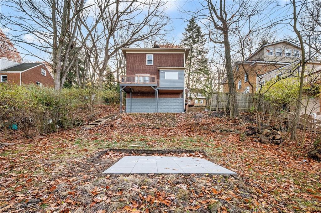 17 Wilkins Road Forest Hills, PA 15221 - Photo 24 of 24 a view of a grey house with a yard