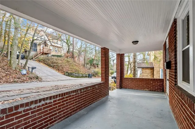 a view of entryway with wooden floor