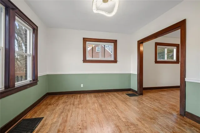 a room with window and wooden floor