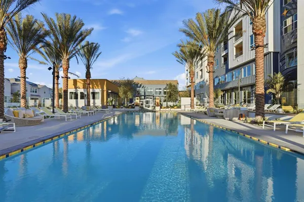a view of swimming pool with outdoor seating