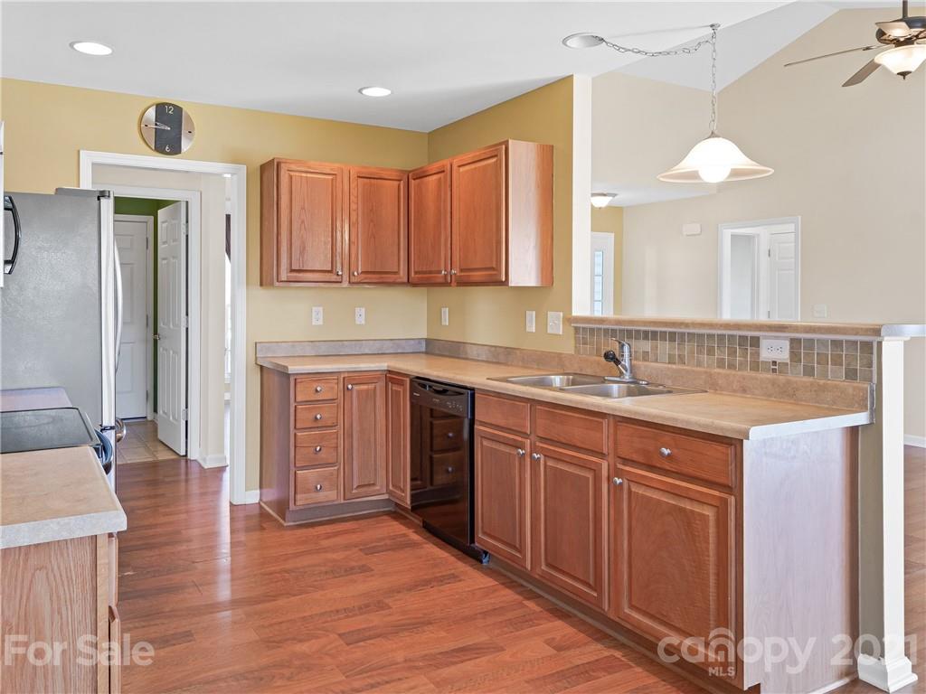 189 Black River Road Fletcher, NC 28732 - Photo 11 of 28 a kitchen with stainless steel appliances granite countertop a sink and cabinets