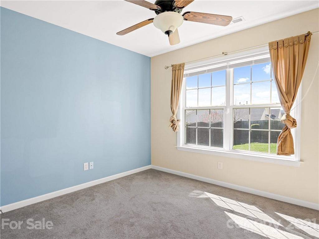 189 Black River Road Fletcher, NC 28732 - Photo 20 of 28 an empty room with a window and a fan