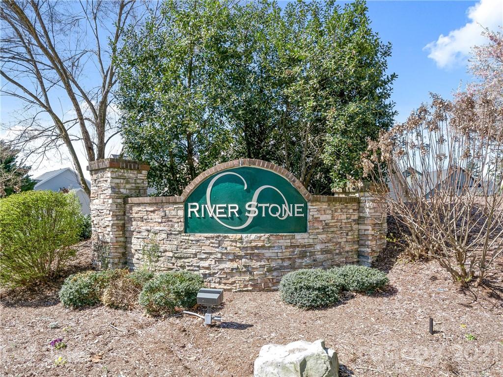 189 Black River Road Fletcher, NC 28732 - Photo 25 of 28 a view of a wooden house with a yard and large trees