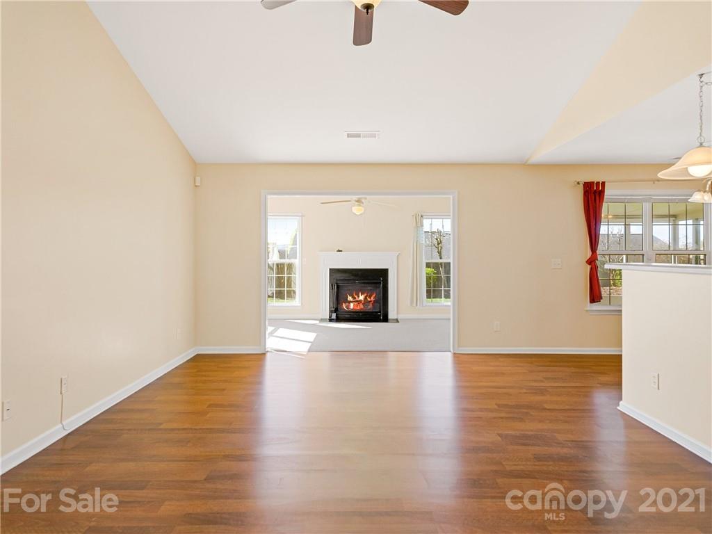 189 Black River Road Fletcher, NC 28732 - Photo 7 of 28 a view of a livingroom with wooden floor and a fireplace
