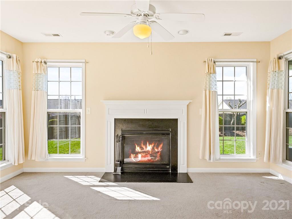 189 Black River Road Fletcher, NC 28732 - Photo 8 of 28 a living room with a fireplace windows and a fireplace