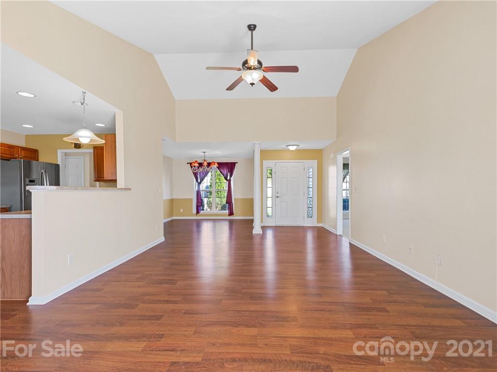 189 Black River Road Fletcher, NC 28732 - Photo 9 of 28 a view of an empty room with wooden floor and a ceiling fan