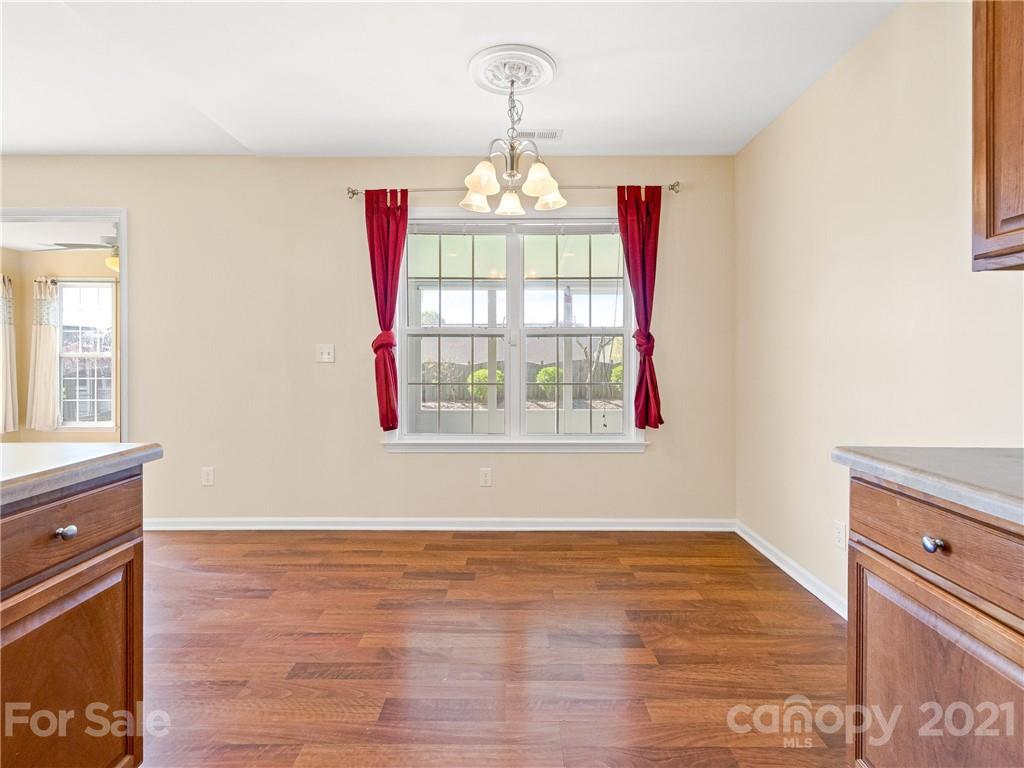 189 Black River Road Fletcher, NC 28732 - Photo 10 of 28 a view of an empty room with wooden floor and windows