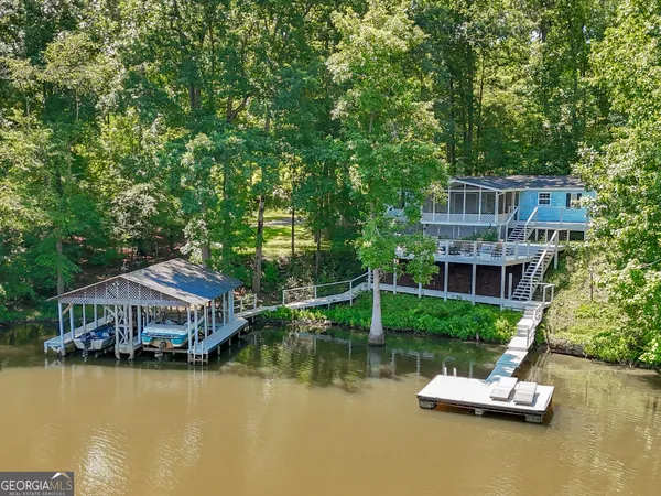 an aerial view of a house with a garden space