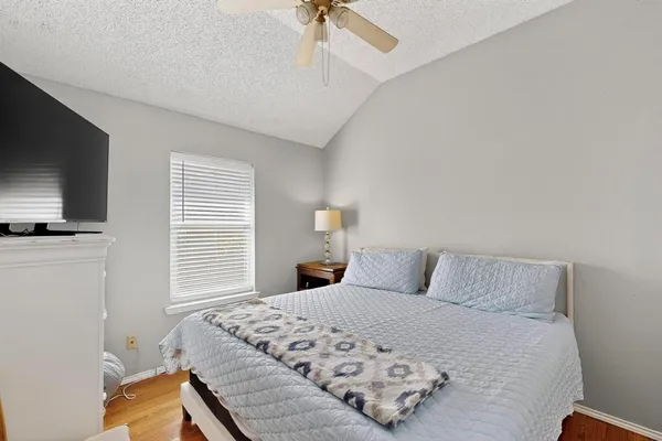 a bathroom with a granite countertop sink a large mirror and a shower