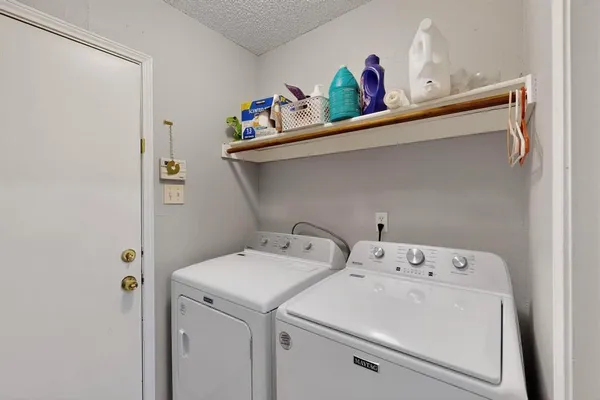 a view of a workspace with furniture