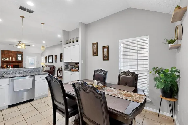 a kitchen with stainless steel appliances granite countertop a refrigerator stove microwave and sink