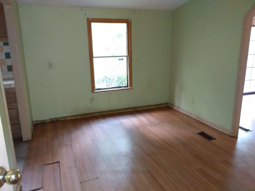 567 Cedar Road Aiken, SC 29803 - Photo 5 of 25 an empty room with wooden floor and windows