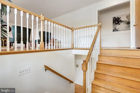 a view of entryway with a window and wooden floor