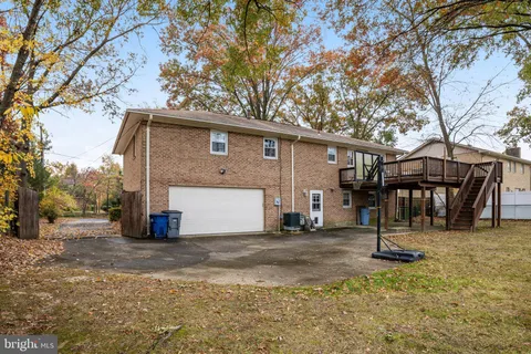 a front view of house with yard and trees