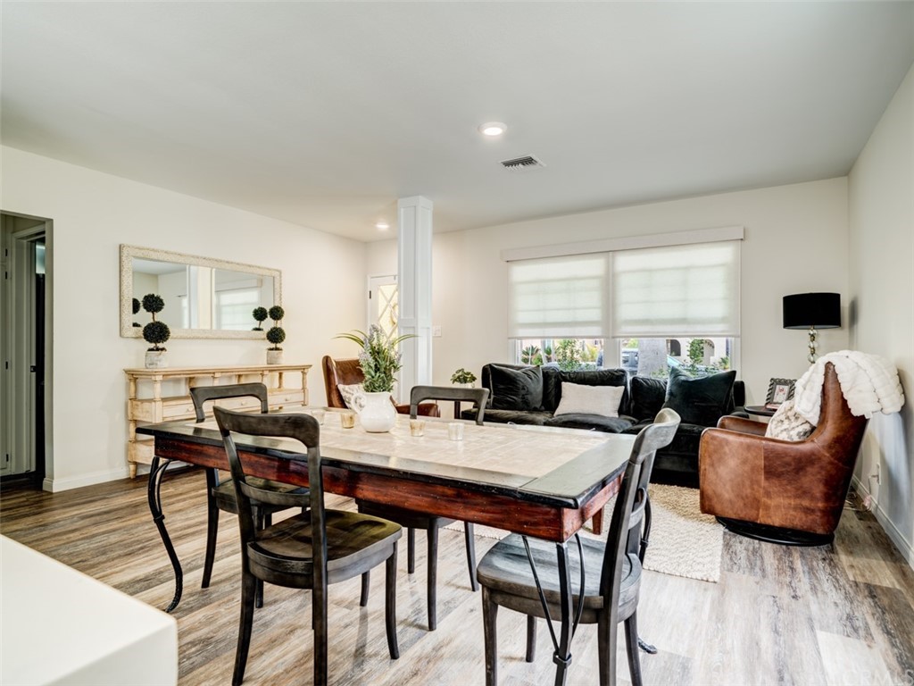 3758 Chatwin Avenue Long Beach, CA 90808 - Photo 12 of 34 a view of a dining room with furniture and wooden floor