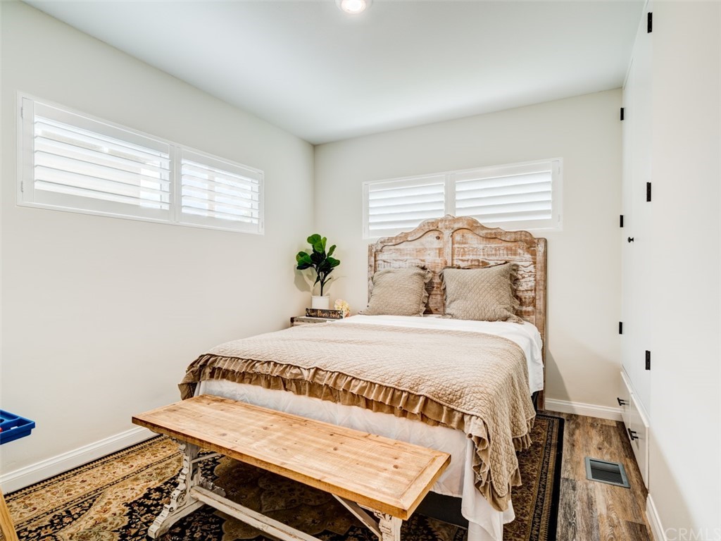 3758 Chatwin Avenue Long Beach, CA 90808 - Photo 18 of 34 a bedroom with a bed and a window