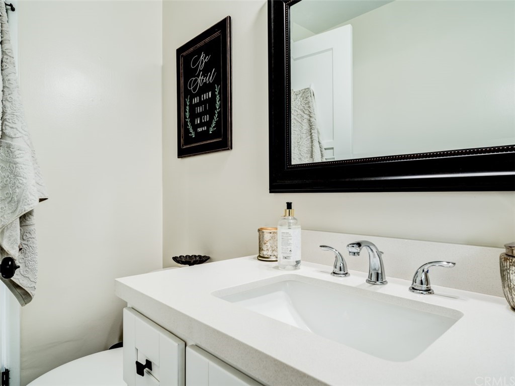 3758 Chatwin Avenue Long Beach, CA 90808 - Photo 22 of 34 a bathroom with a sink and a toilet