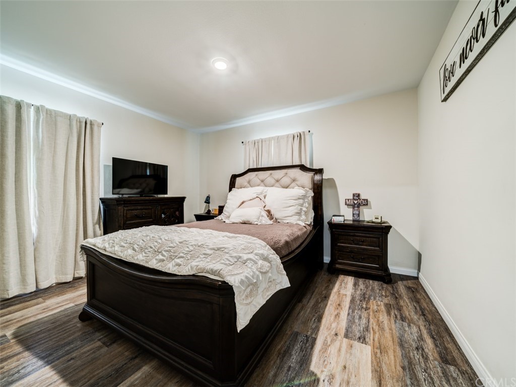 3758 Chatwin Avenue Long Beach, CA 90808 - Photo 24 of 34 a bed sitting in a bedroom and flat screen tv