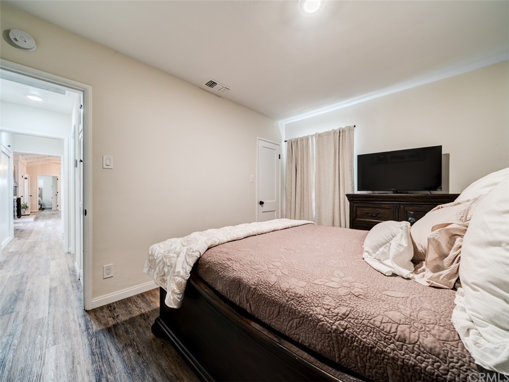 3758 Chatwin Avenue Long Beach, CA 90808 - Photo 25 of 34 a bedroom with a bed and a flat screen tv