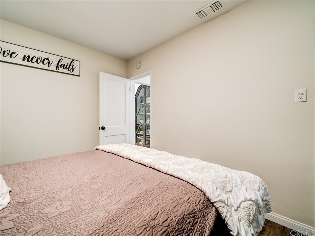 3758 Chatwin Avenue Long Beach, CA 90808 - Photo 26 of 34 a bedroom with a bed and cabinets