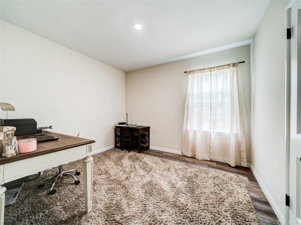 3758 Chatwin Avenue Long Beach, CA 90808 - Photo 27 of 34 a view of a workspace with furniture and window