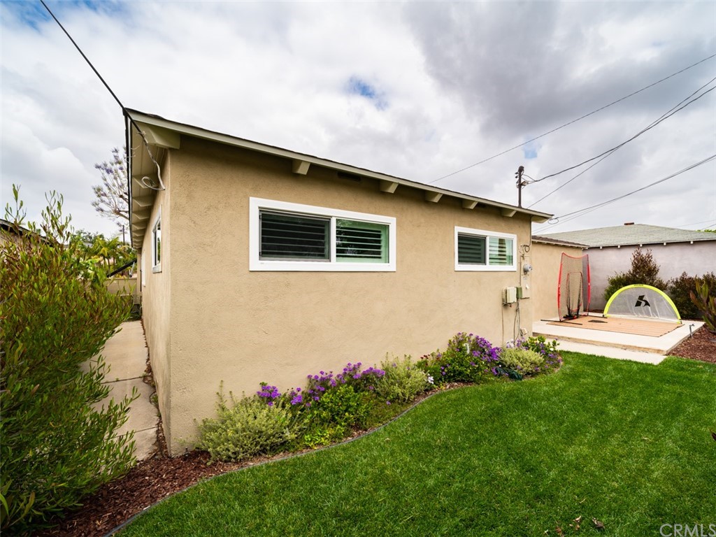 3758 Chatwin Avenue Long Beach, CA 90808 - Photo 30 of 34 a house view with a backyard space