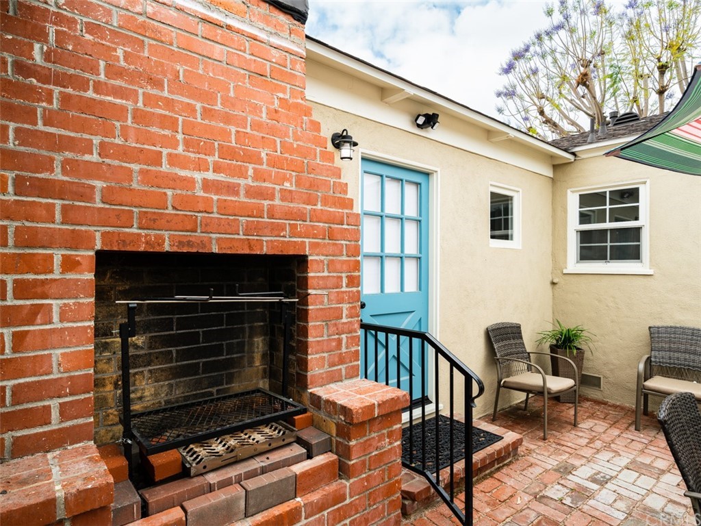 3758 Chatwin Avenue Long Beach, CA 90808 - Photo 31 of 34 a dining room with furniture and a fireplace