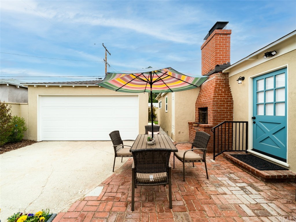 3758 Chatwin Avenue Long Beach, CA 90808 - Photo 34 of 34 a patio with table and chairs