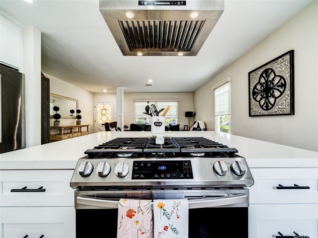 3758 Chatwin Avenue Long Beach, CA 90808 - Photo 7 of 34 a stove top oven sitting inside of a kitchen