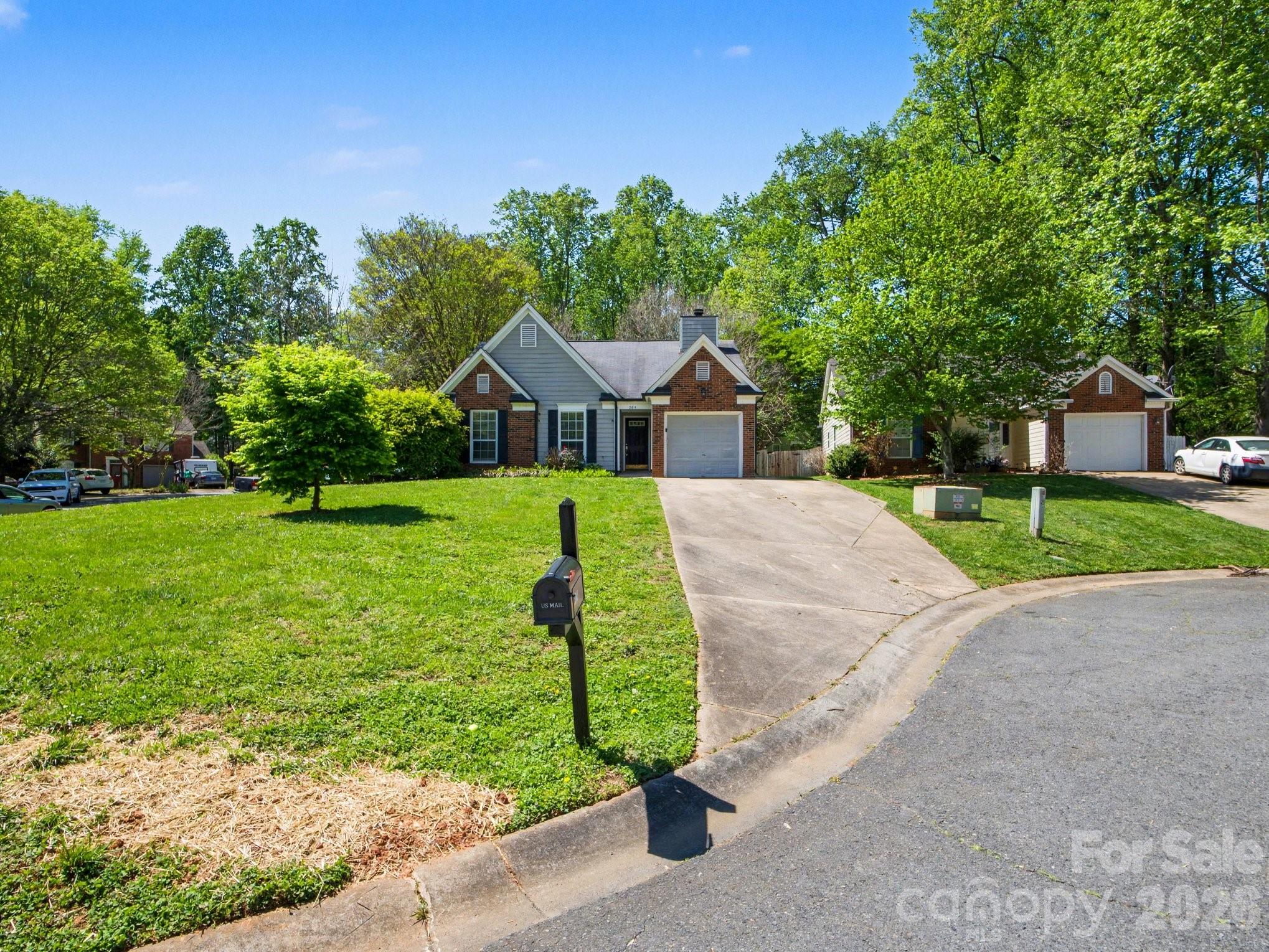 9214 Rotherham Lane Charlotte, NC 28216 - Photo 2 of 20 a view of a house with a yard