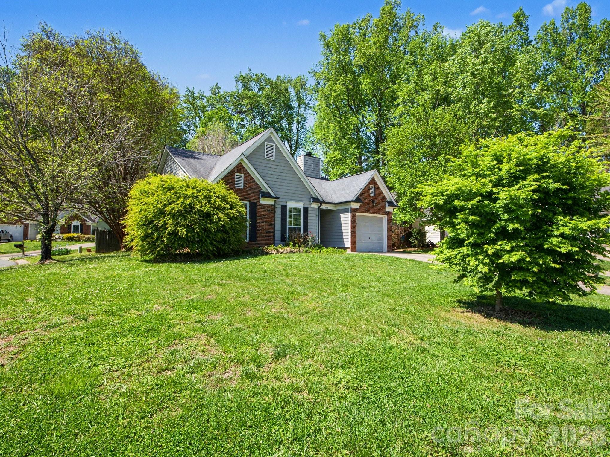 9214 Rotherham Lane Charlotte, NC 28216 - Photo 4 of 20 a front view of a house with garden