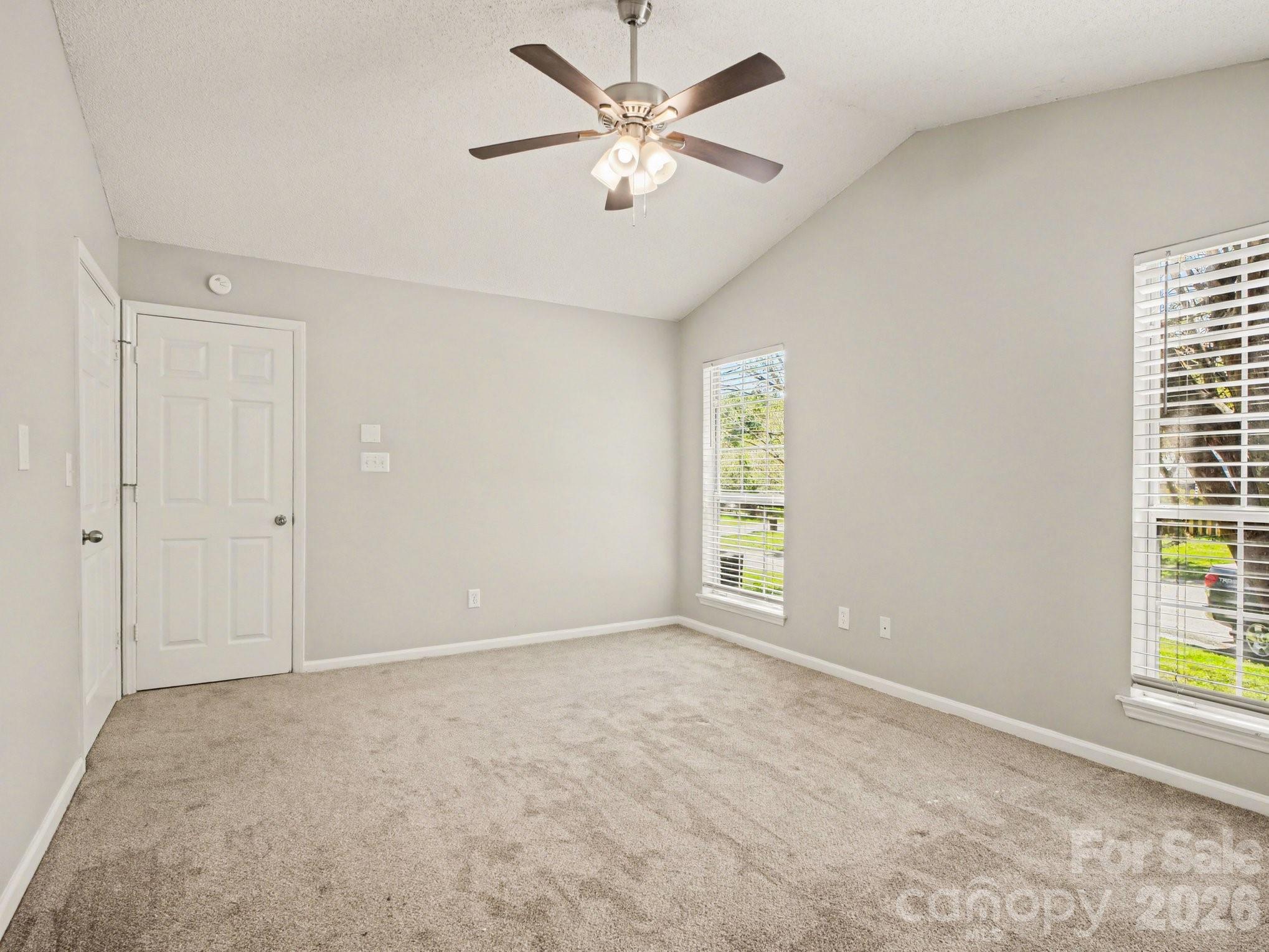 9214 Rotherham Lane Charlotte, NC 28216 - Photo 7 of 20 a view of an empty room with a window