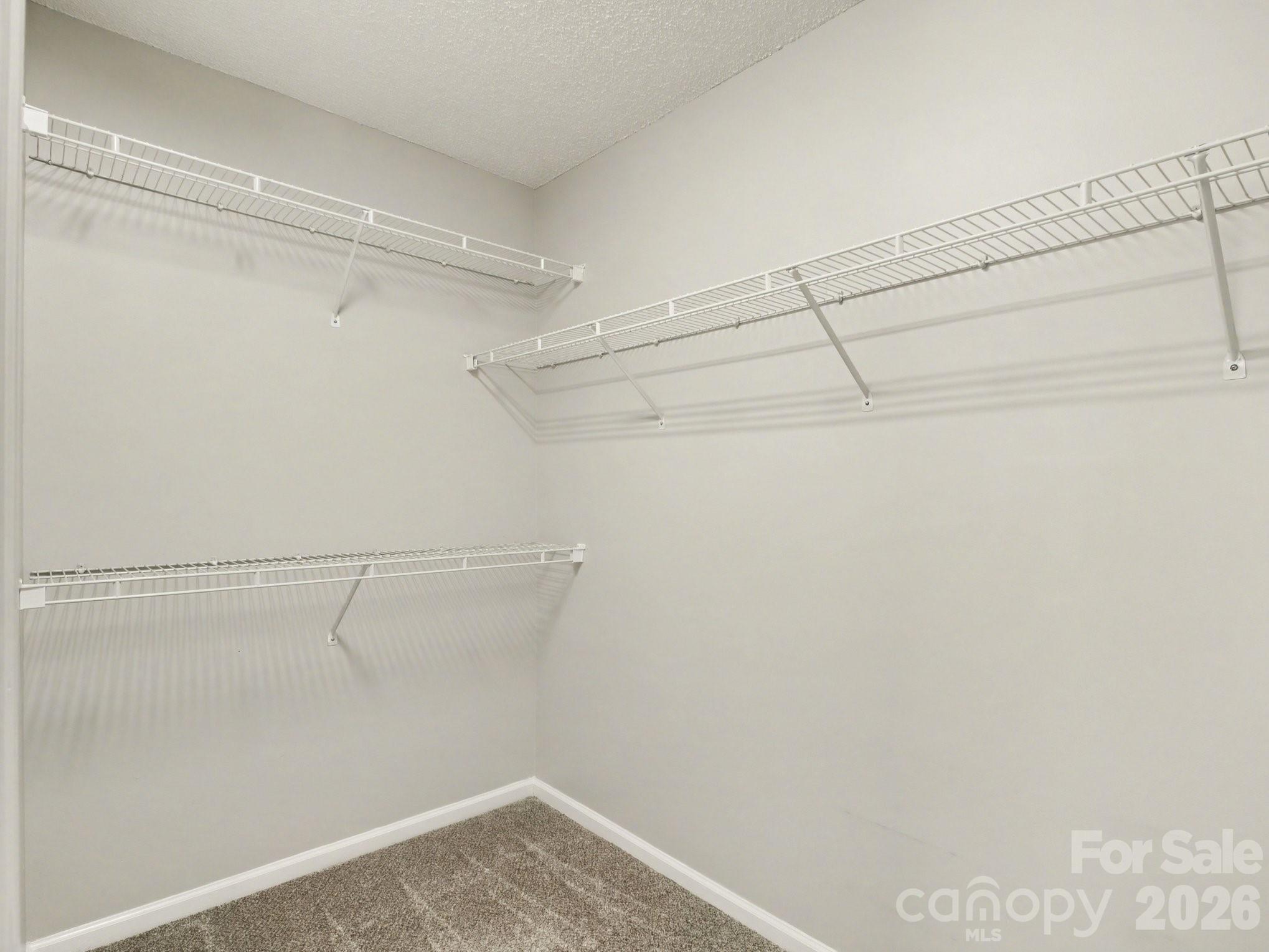 9214 Rotherham Lane Charlotte, NC 28216 - Photo 9 of 20 a view of a room with racks on the wall