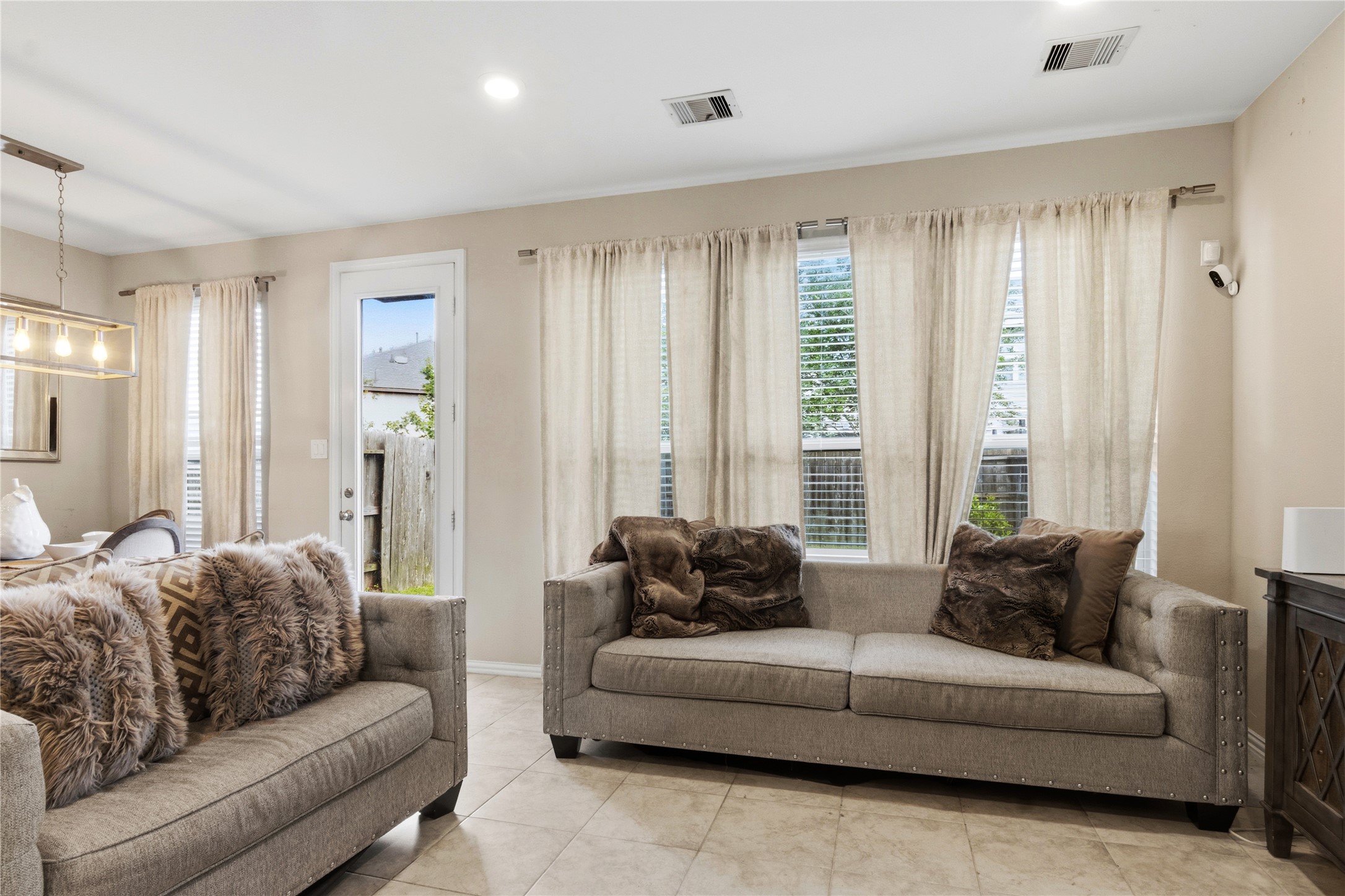 1815 Ryon Falls Drive Richmond, TX 77469 - Photo 6 of 24 a living room with furniture and a large window