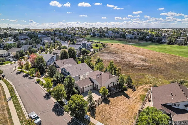 an aerial view of a house with a lake view