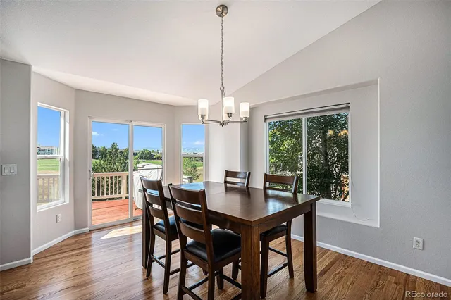 a view of a kitchen with a sink and a refrigerator