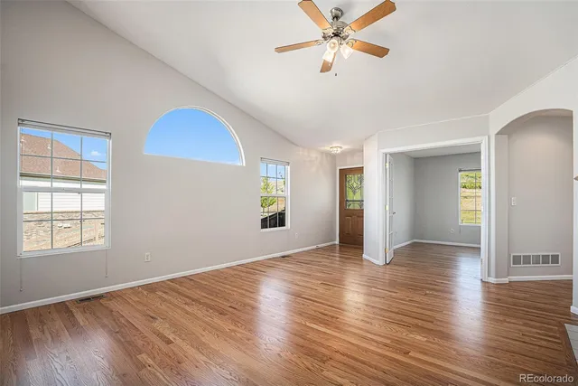 a view of a kitchen counter space and wooden floor